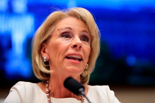 FILE - In this April 10, 2019, file photo, Education Secretary Betsy DeVos testifies before the House Education and Labor Committee at a hearing on 'Examining the Policies and Priorities of the U.S. Department of Education' on Capitol Hill in Washington. Education, it‚Äôs safe to say, is not President Donald Trump‚Äôs top priority. Instead, he entrusts that realm to Education Secretary Betsy DeVos, who after two years has emerged as one of the most polarizing figures in the Cabinet but also one of its most enduring members. (AP Photo/Manuel Balce Ceneta, File)
