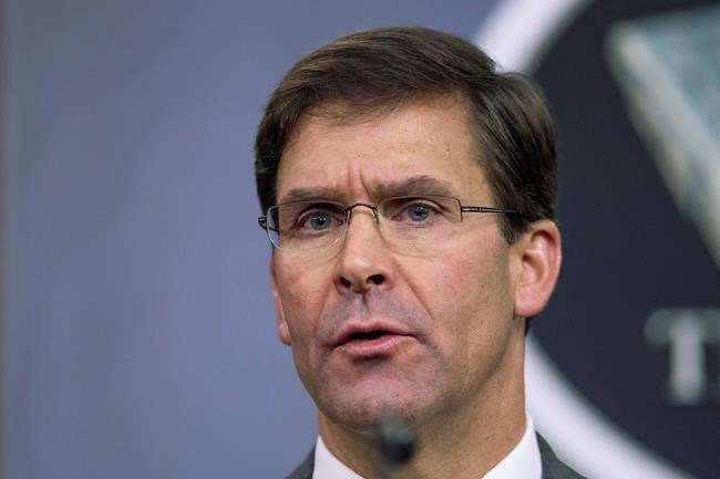 FILE - In this Aug. 28, 2019, file photo, Secretary of Defense Mark Esper speaks to reporters during a briefing at the Pentagon. Esper says the