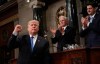 FILE - In this Jan. 30, 2018, file photo, President Donald Trump gestures as he finishes his first State of the Union address in the House chamber of the U.S. Capitol to a joint session of Congress in Washington, as Vice President Mike Pence and House Speaker Paul Ryan applaud. (Win McNamee/Pool via AP, File)