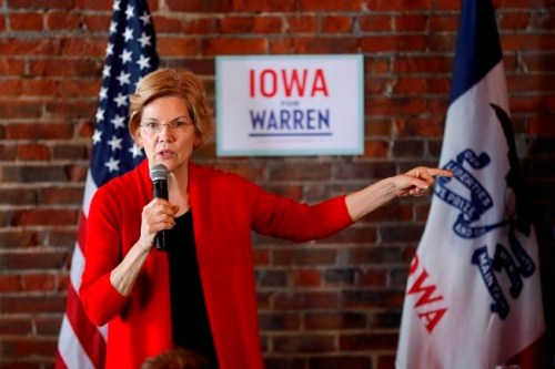 FILE - In this March 1, 2019, file photo, Democratic presidential candidate Sen. Elizabeth Warren speaks to local residents during an organizing event in Dubuque, Iowa. Warren is everywhere in the first three months of her presidential campaign: 11 states as of Tuesday. But where she's not is at the top of early 2020 polls. (AP Photo/Charlie Neibergall, File)