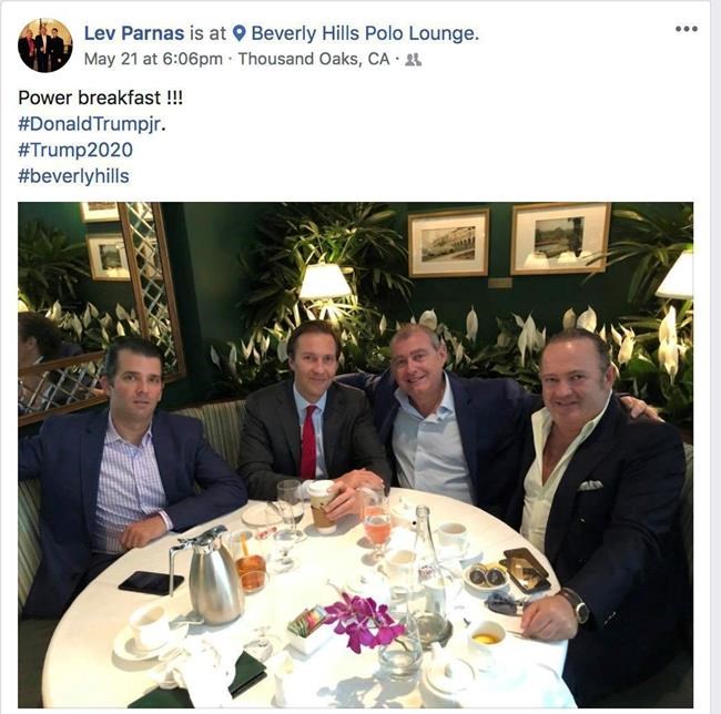 This Facebook screen shot provided by The Campaign Legal Center, shows from left, Donald Trump, Jr., Tommy Hicks, Jr., Lev Parnas and Igor Fruman, posted on May 21, 2018. (The Campaign Legal Center via AP)