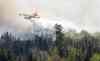 JOE BRYKSA / WINNIPEG FREE PRESS
Water bombers working hard to control hot forest fire spots on the east side of Caddy Lake Tuesday.