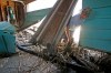 JOE BRYKSA / WINNIPEG FREE PRESS
Michael Fey peeks into the garage of his Breezy Point home Wednesday. It was destroyed by massive ice chunks Sunday.