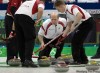 PHIL.HOSSACK@FREEPRESS.MB.CA 
Canadian skip Kevin Martin guides sweepers Marc Kennedy (right) and Ben Hebert (left) against Denmark Friday at Vancouver Olympics.