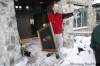 J0E BRYKSA / WINNIPEG FREE PRESS
Homeowner Tim Corwin holds a portrait of his great great gradfather as he yells instructions to volunteers  helping him move from his home in the River Road area in Fargo Thursday night.