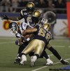 TREVOR.HAGAN@FREEPRESS.MB.CA
Joe Lobendahn, Lenny Walls and Ike Charlton bring down Jason Carter in Bombers action Saturday night.