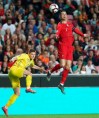 Portugal's Cristiano Ronaldo, right, challenges for the ball with Ukraine's Vitaliy Mykolenko during the Euro 2020 group B qualifying soccer match between Portugal and Ukraine at the Luz stadium in Lisbon, Friday, March 22, 2019. (AP Photo/Armando Franca)