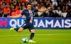 PSG's Edinson Cavani scores on a penalty kick his side's opening goal during the French League One soccer match between Paris Saint Germain and Nimes at the Parc des Princes Stadium in Paris, Sunday, Aug. 11, 2019. (AP Photo/Francois Mori)