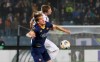 Roma's Nicolo Zaniolo, foreground, jumps for the ball with Wolfsberger's Michael Sollbauer during the Europa League group J soccer match between Wolfsberger AC and Roma, in Graz, Austria, Thursday, Oct. 3, 2019. (AP Photo/Ronald Zak)