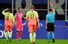 Referee Aleksei Kulbakov, right, gives a red card to Manchester City's goalkeeper Claudio Bravo, second from left, during the Champions League group C soccer match between Atalanta and Manchester City at the San Siro stadium in Milan, Italy, Wednesday, Nov. 6, 2019. (AP Photo/Luca Bruno)