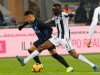 Inter Milan's Lautaro Martinez and Udinese's Seko Fofana, right, vie for the ball during an Italian Serie A soccer match between Inter Milan and Udinese, at the San Siro stadium in Milan, Italy, Saturday, Dec. 15, 2018. (AP Photo/Antonio Calanni)
