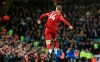 Liverpool's Jordan Henderson celebrates after scoring his side's opening goal during the English Premier League soccer match between Liverpool and Tottenham Hotspur at Anfield stadium in Liverpool, England, Sunday, Oct. 27, 2019. (AP Photo/Jon Super)