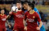 Fiorentina's Vitor Hugo, center, challenges for the ball with Roma's Bryan Cristante, left, and Roma's Diego Perotti during the Serie A soccer match between Roma and Fiorentina at the Rome Olympic stadium, Wednesday, April 3, 2019. (AP Photo/Andrew Medichini)