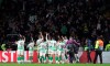 Celtic's players wave their supporter as they celebrate at the end of the Europa League group E soccer match between Celtic and Lazio at Celtic Park stadium in Glasgow, Scotland, Thursday, Oct. 24, 2019. Celtic won 2-1. (AP Photo/Scott Heppell)