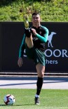 Cristiano Ronaldo stretches during a training session of the Portuguese soccer team in Oeiras, outside Lisbon, Tuesday, March 19, 2019. Portugal will play Ukraine in a Euro 2020 qualifying match March 22. (AP Photo/Armando Franca)