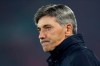 Genk's manager Felice Mazzu watches the players during warmup before the Champions League group E soccer match between Liverpool and Genk at Anfield Stadium, Liverpool, England, Tuesday, Nov. 5, 2019. (AP Photo/Jon Super)