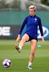 United States' Megan Rapinoe kicks a ball during a training session of the US Women's Soccer team at a training ground in Lyon, France, Monday, July 1, 2019. The US will face England in a Women's World Cup semifinal match Tuesday in Lyon. (AP Photo/Laurent Cipriani)