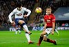 Tottenham's Son Heung-Min has a shot blocked by Manchester United's Ander Herrera, right, during the English Premier League soccer match between Tottenham Hotspur and Manchester United at Wembley stadium in London, England, Sunday, Jan. 13, 2019. (AP Photo/Tim Ireland)