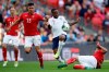Bulgaria's Georgi Sarmov, right, tackles England's Raheem Sterling during the Euro 2020 group A qualifying soccer match between England and Bulgaria at Wembley stadium in London, Saturday, Sept. 7, 2019. (AP Photo/Matt Dunham)