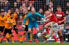 Wolverhampton goalkeeper John Ruddy, center, eyes the ball during the English FA Cup fifth round soccer match between Bristol City and Wolverhampton Wanderers at Ashton Gate stadium in Bristol, England, Sunday, Feb. 17, 2019. (AP Photo/Frank Augstein)