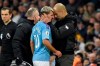 Manchester City's head coach Pep Guardiola, right, talks with Sergio Aguero as he is substituted after getting injured during the English Premier League soccer match between Manchester City and Chelsea at Etihad stadium in Manchester, England, Saturday, Nov. 23, 2019. (AP Photo/Rui Vieira)