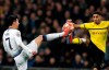 Tottenham midfielder Son Heung-min fights for the ball with Dortmund defender Achraf Hakimi, right, during the Champions League round of 16, first leg, soccer match between Tottenham Hotspur and Borussia Dortmund at Wembley stadium in London, Wednesday, Feb. 13, 2019. (AP Photo/Alastair Grant)