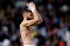 Real Madrid's Karim Benzema applauds the fans at the end of a Spanish La Liga soccer match between Real Madrid and Huesca at the Santiago Bernabeu stadium in Madrid, Sunday, March 31, 2019. Benzema scored the third goal in Real Madrid's 3-2 win. (AP Photo/Bernat Armangue)