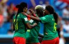 Cameroon's Augustine Ejangue, right, confronts teammate Aurelle Awona after she scored an own goal to tie the match during the Women's World Cup Group E soccer match between Cameroon and New Zealand at the Stade de la Mosson in Montpellier, France, Thursday, June 20, 2019. (AP Photo/Claude Paris)