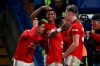 Manchester United's Marcus Rashford, background center, celebrates after scoring his side's second goal during the English League Cup soccer match between Chelsea and Manchester United at Stamford Bridge in London, Wednesday, Oct. 30, 2019. (AP Photo/Ian Walton)