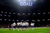 Tottenham players celebrate after Christian Eriksen scored their side's second goal during the English Premier League soccer match betweenTottenham Hotspur and Crystal Palace, the first Premiership match at the new Tottenham Hotspur stadium in London, Wednesday, April 3, 2019. (AP Photo/Kirsty Wigglesworth)