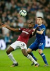 Everton's Seamus Coleman vies for the ball with West Ham's Michail Antonio, left, during the English Premier League soccer match between West Ham United and Everton at London Stadium in London, Saturday, March 30, 2019. (AP Photo/Tim Ireland)