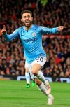 Manchester City's Bernardo Silva celebrates after scoring the opening goal during the English Premier League soccer match between Manchester United and Manchester City at Old Trafford Stadium in Manchester, England, Wednesday April 24, 2019. (AP Photo/Jon Super)