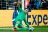 Liverpool's goalkeeper Adrian stops a penalty shot from Chelsea's Tammy Abraham during the UEFA Super Cup soccer match between Liverpool and Chelsea, in Besiktas Park, in Istanbul, Thursday, Aug. 15, 2019. Liverpool won 5-4 in a penalty shootout after the game ended tied 2-2. (AP Photo/Thanassis Stavrakis)