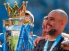 Manchester City coach Pep Guardiola lifts the English Premier League trophy after the English Premier League soccer match between Brighton and Manchester City at the AMEX Stadium in Brighton, England, Sunday, May 12, 2019. Manchester City defeated Brighton 4-1 to win the championship. (AP Photo/Frank Augstein)