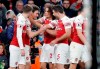 Arsenal's Laurent Koscielny, second left celebrates with teammates after scoring his sides2nd goal during the English Premier League soccer match between Arsenal and Chelsea at the Emirates stadium in London, Saturday, Jan. 19, 2019. (AP Photo/Frank Augstein)