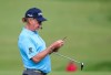 Miguel Jimenez checks his yardage book on the 1st green during a practice round ahead of the start of the British Open golf championships at Royal Portrush in Northern Ireland, Tuesday, July 16, 2019. The British Open starts Thursday. (AP Photo/Peter Morrison)