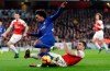 Chelsea's Willian, left is tackled by Arsenal's Sokratis Papastathopoulos during the English Premier League soccer match between Arsenal and Chelsea at the Emirates stadium in London, Saturday, Jan. 19, 2019. (AP Photo/Frank Augstein)