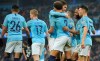Manchester City's Kyle Walker, No 2, celebrates with teammates after Rotherham's Semi Ajayi scored an own goal during the English FA Cup third round soccer match between Manchester City and Rotherham United at Etihad stadium in Manchester, England, Sunday, Jan. 6, 2019. (AP Photo/Rui Vieira)