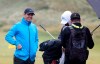 Northern Ireland's Rory McIlroy smiles as he talks to his team on the practice range ahead of the start of the British Open golf championships at Royal Portrush in Northern Ireland, Wednesday, July 17, 2019. The British Open starts Thursday. (AP Photo/Jon Super)