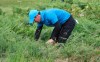 Northern Ireland's Rory McIlroy looks for his ball in the long rough on the 1st hole during the first round of the British Open Golf Championships at Royal Portrush in Northern Ireland, Thursday, July 18, 2019.(AP Photo/Peter Morrison)