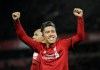 Liverpool's Roberto Firmino celebrates after he scores his sides 5th goal and his 3rd from the penalty spot during the English Premier League soccer match between Liverpool and Arsenal at Anfield in Liverpool, England, Saturday, Dec. 29, 2018. (AP Photo/Rui Vieira)
