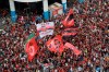 Fans of Brazil's Flamengo cheer as they wait for their arrival in Rio de Janeiro, Brazil, Sunday, Nov. 24, 2019. Flamengo overcame Argentina's River Plate 2-1 in the Copa Libertadores final match on Saturday in Lima to win its second South American title. (AP Photo/Silvia Izquierdo)
