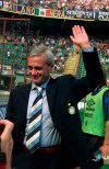FILE - In this file photo taken on Aug. 31, 1997, Gigi Simoni, then coach of Inter of Milan, salutes Inter fans prior to a match at Milan's San Siro stadium. The wife of Luigi “Gigi” Simoni says the former Inter Milan coach remains in critical condition after suffering a stroke in June (AP Photo/Luca Bruno)