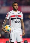 Brazilian soccer player Dani Alves poses for photos as he is presented as the new defender of the Sao Paulo soccer club at Morumbi stadium in Sao Paulo, Brazil, Tuesday, Aug. 6, 2019. The 36-year-old former Barcelona, Juventus and Paris Saint-Germain defender signed a free transfer deal to play for his boyhood team Sao Paulo FC. (AP Photo/Andre Penner)