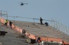 Men work on the stands of Itaquerao stadium in Sao Paulo, Brazil, Thursday, May 8, 2014. The still unfinished stadium will host the World Cup opener match between Brazil and Croatia on June 12. (AP Photo/Andre Penner)