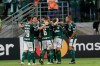 Players of Brazil's Palmeiras celebrate after teammate Hyoran, second from right, scored their third goal during a Copa Libertadores soccer match against Colombia's Junior in Sao Paulo, Brazil, Wednesday, April 10, 2019. (AP Photo/Andre Penner)