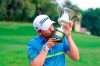 Austria's Bernd Wiesberger kisses the cup after winning the Golf Italian Open 2019, in Rome, Sunday, Oct. 13, 2019. (Giorgio Maiozzi/ANSA via AP)