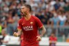 Roma's Aleksandar Kolarov celebrates after scoring the opening goal during a Serie A soccer match between Lazio and Roma, at the Rome Olympic stadium, Sunday, Sept. 1, 2019. (AP Photo/Alessandra Tarantino)
