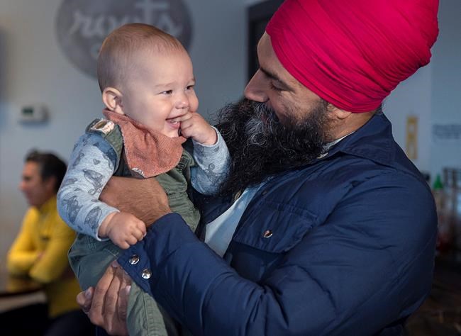 NDP Leader Jagmeet Singh hold seven-month-old Alder Tull-Best at a campaign stop in Vancouver on Tuesday, Oct. 1, 2019. THE CANADIAN PRESS/Andrew Vaughan