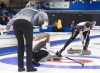 Defending champions Laura Walker and Kirk Muyre, right, work a rock as Bobbie Sauder, left, looks on at the Canadian mixed doubles curling championships at Willie O'Ree Place in Fredericton, N.B., on Saturday, March 23, 2019. THE CANADIAN PRESS/Andrew Vaughan